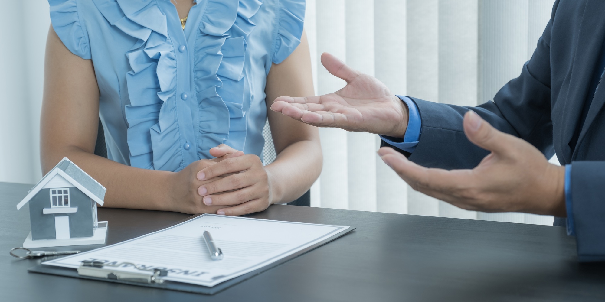 The real estate agent explains the business contract