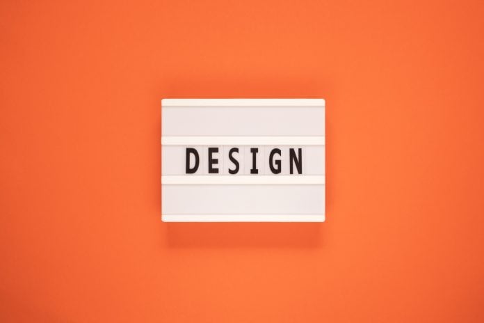 The word design on lightbox isolated orange background