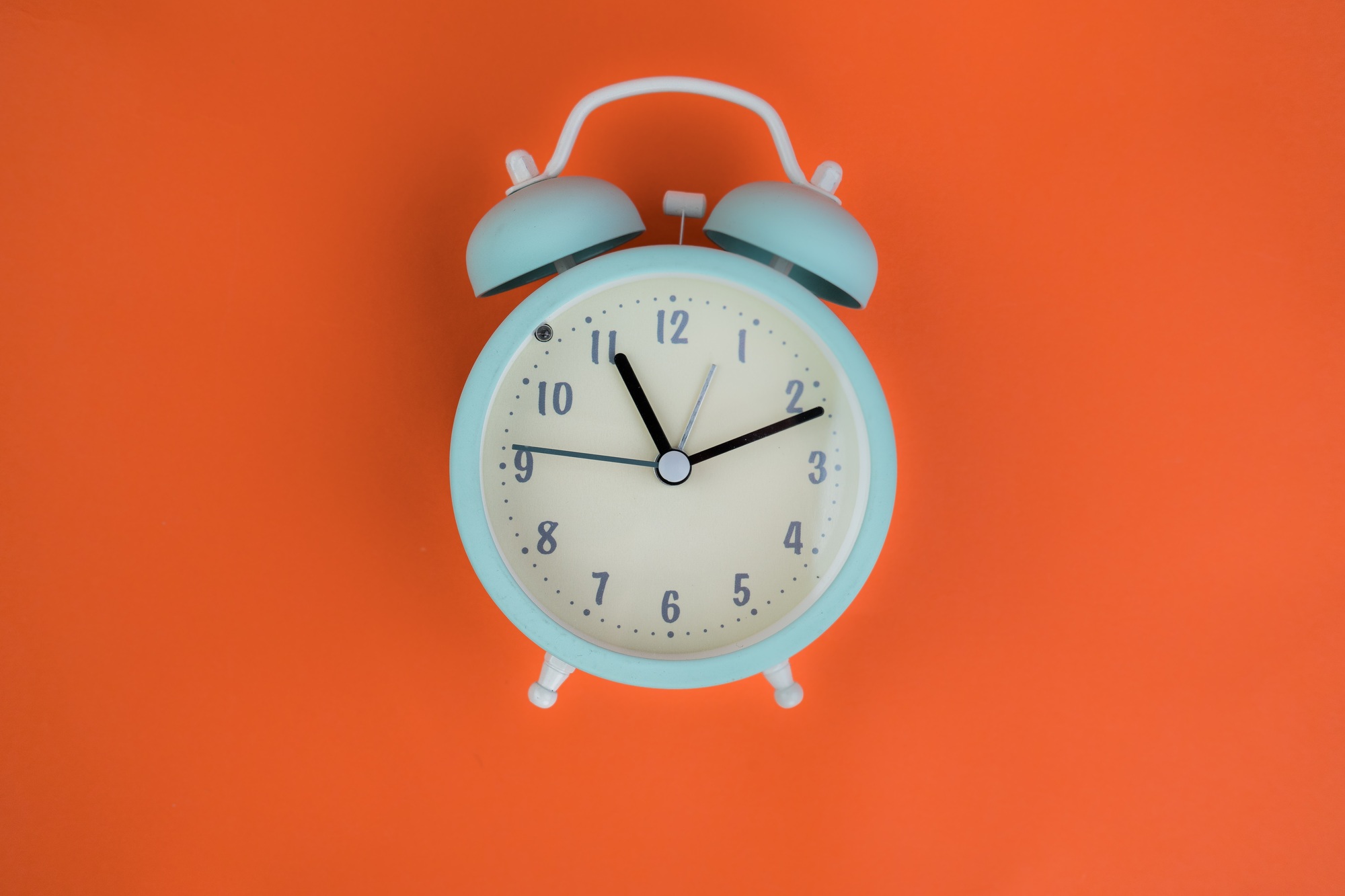 topdown vintage alarm clocks ringing, animation on orange background