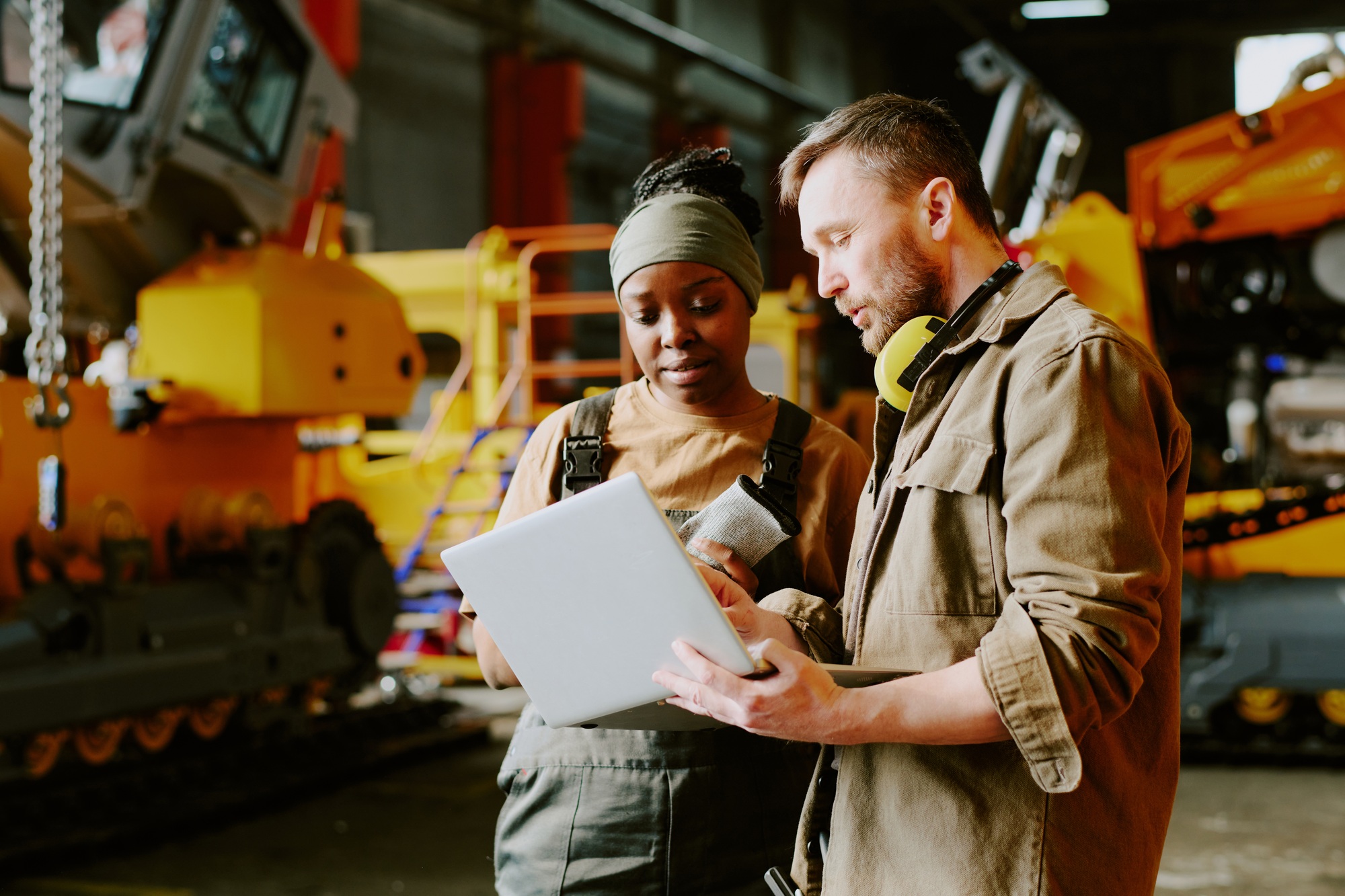 Two Technicians Discussing Issues At Work