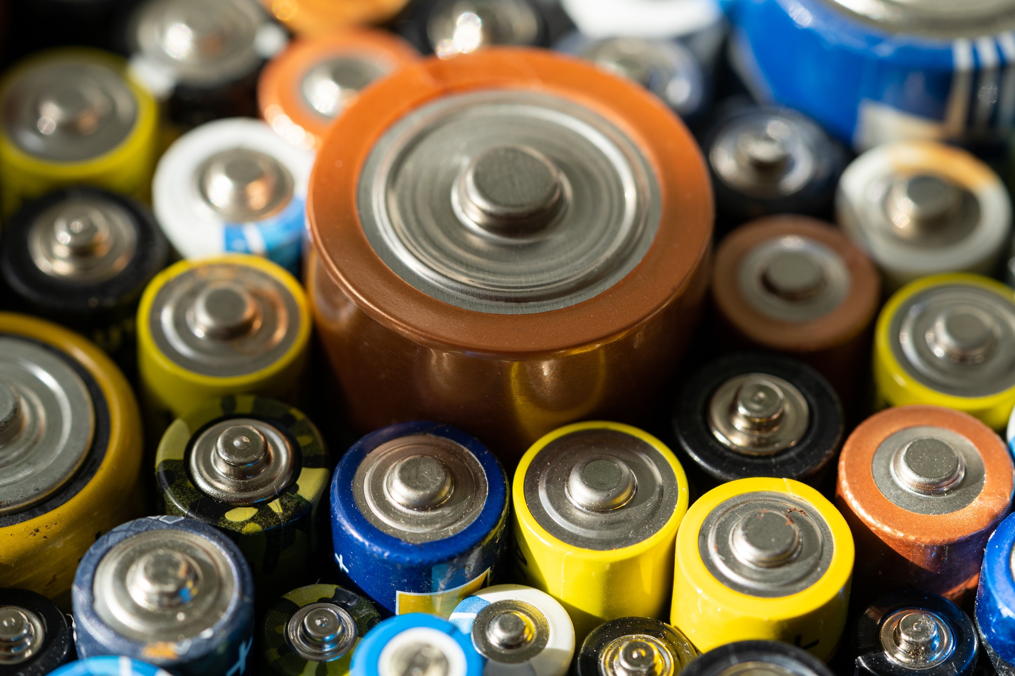 Used batteries different sizes, close up