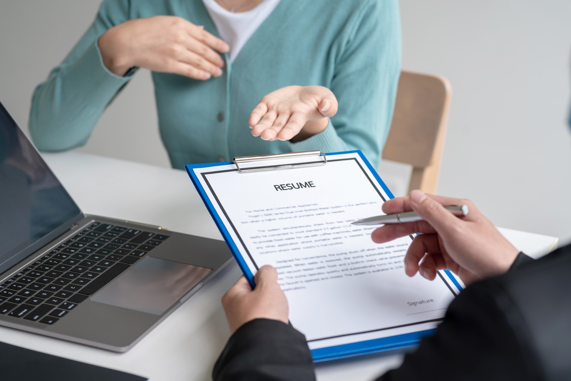 Woman who explains a resume to an employer. job application concept
