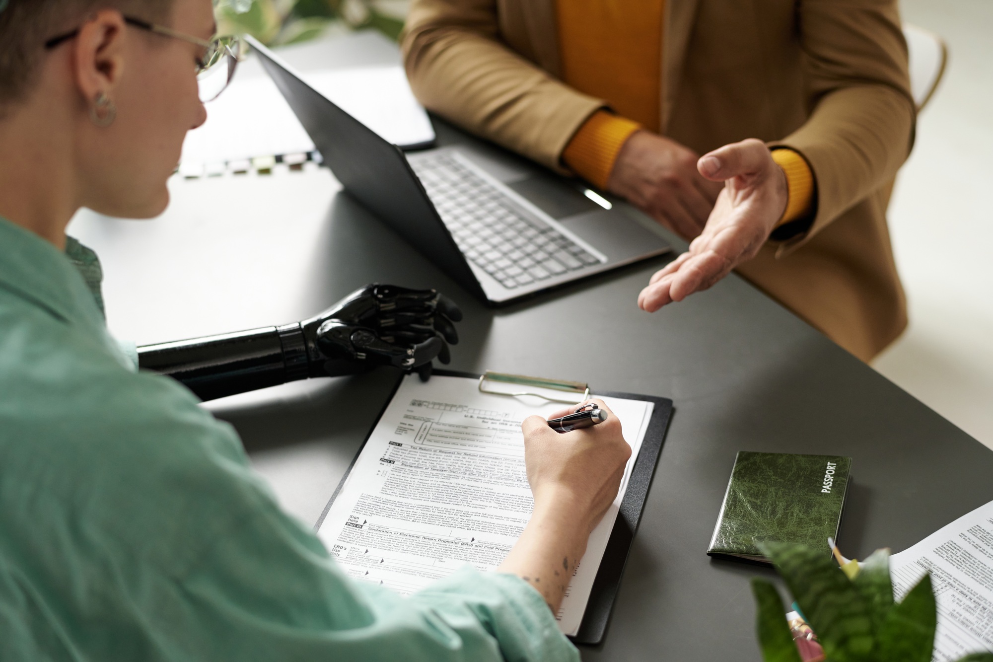 Woman with disability having consultation with insurance agent