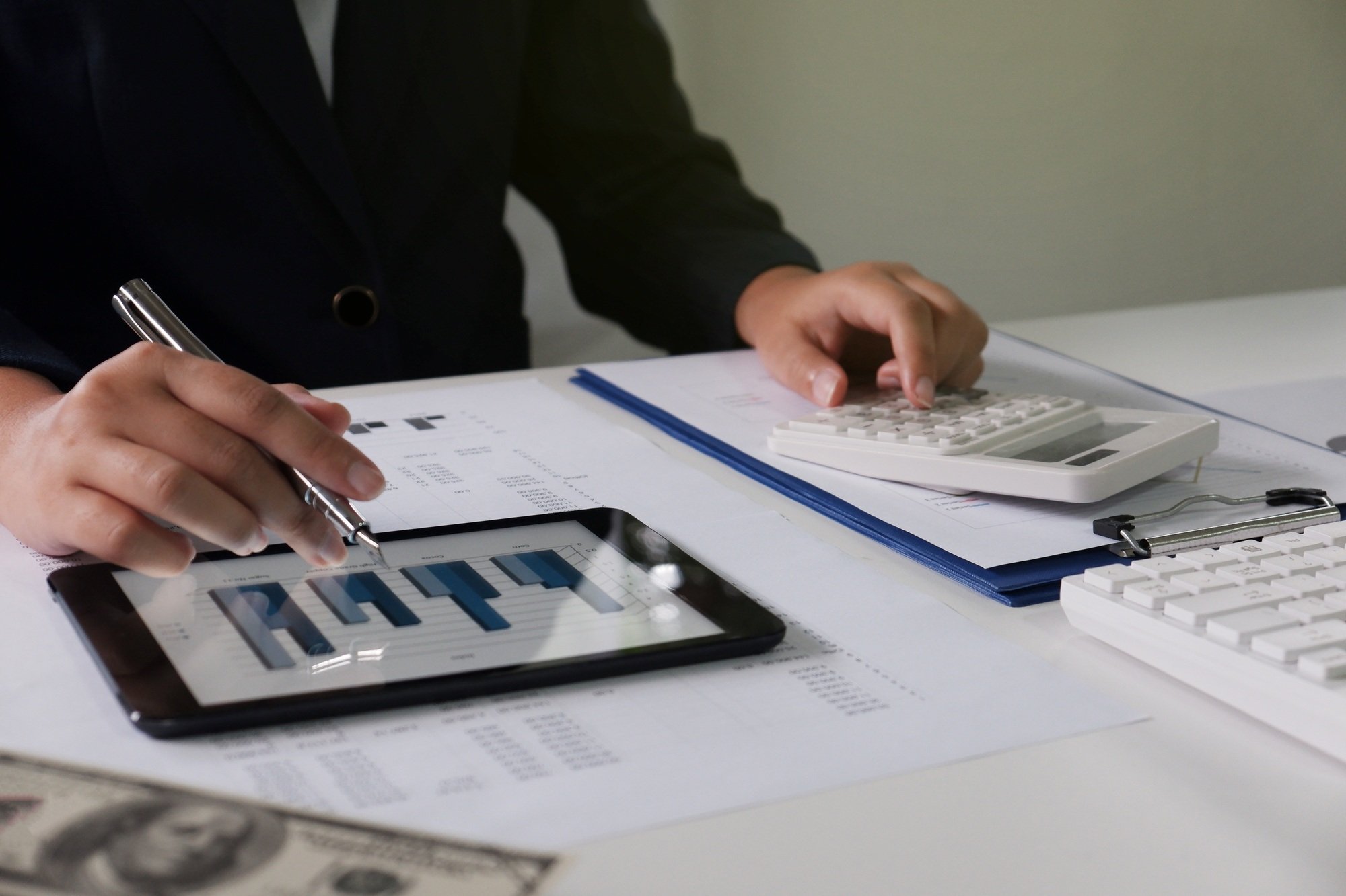 Women working in office calculating, analyze for business, accounting, insurance or finance concept.
