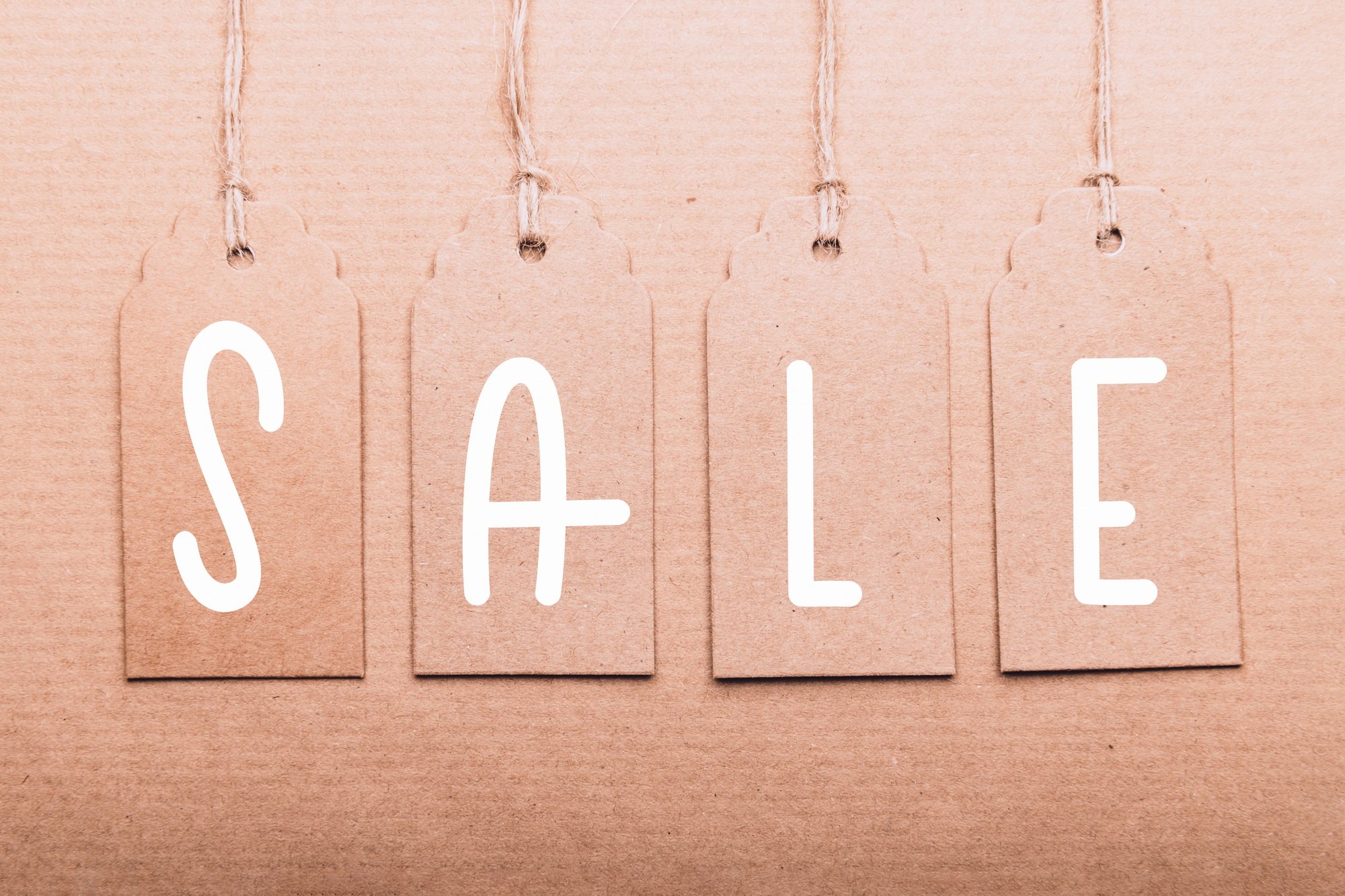 Word sale written on paper tags