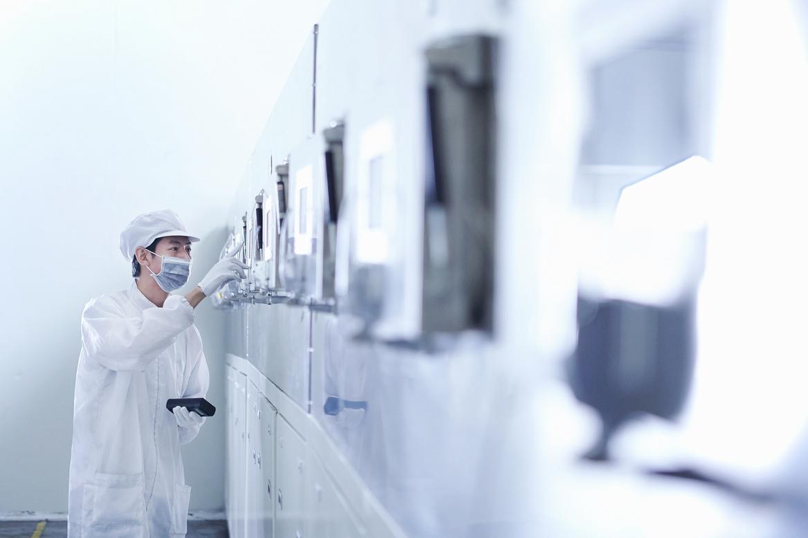 Worker at e-cigarettes battery factory, Guangdong, China