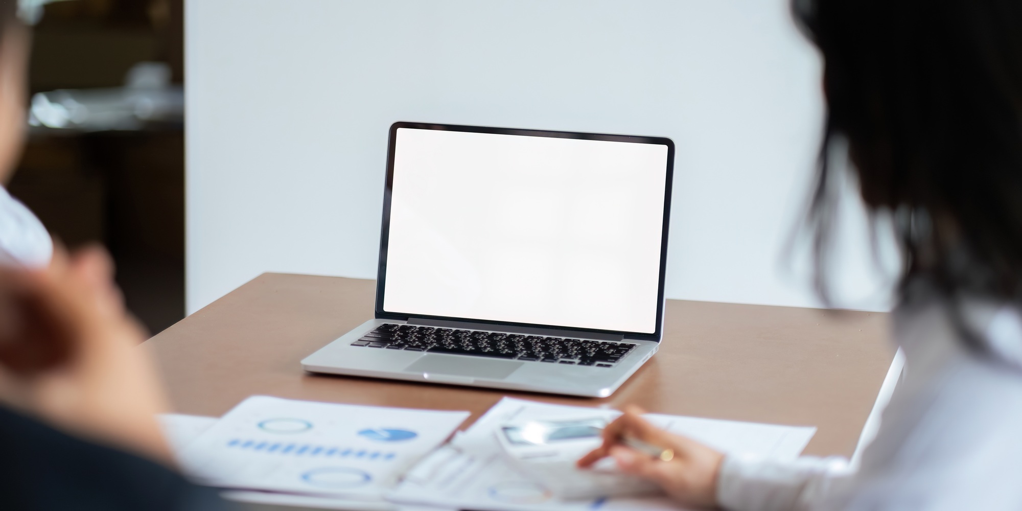 Asia business use laptop with blank white screen mock up display for advertising text while working