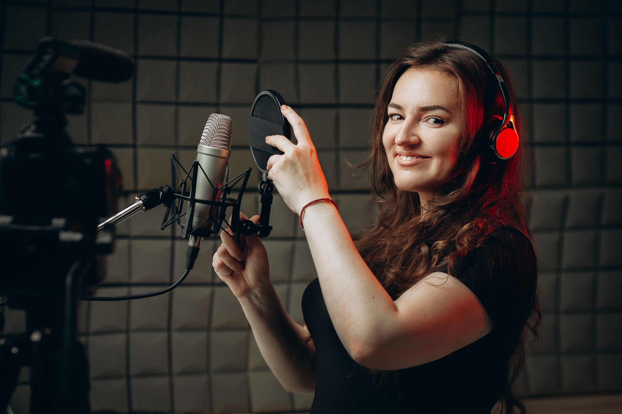 Attractive woman blogger speaks about professional voice over and dubbing.