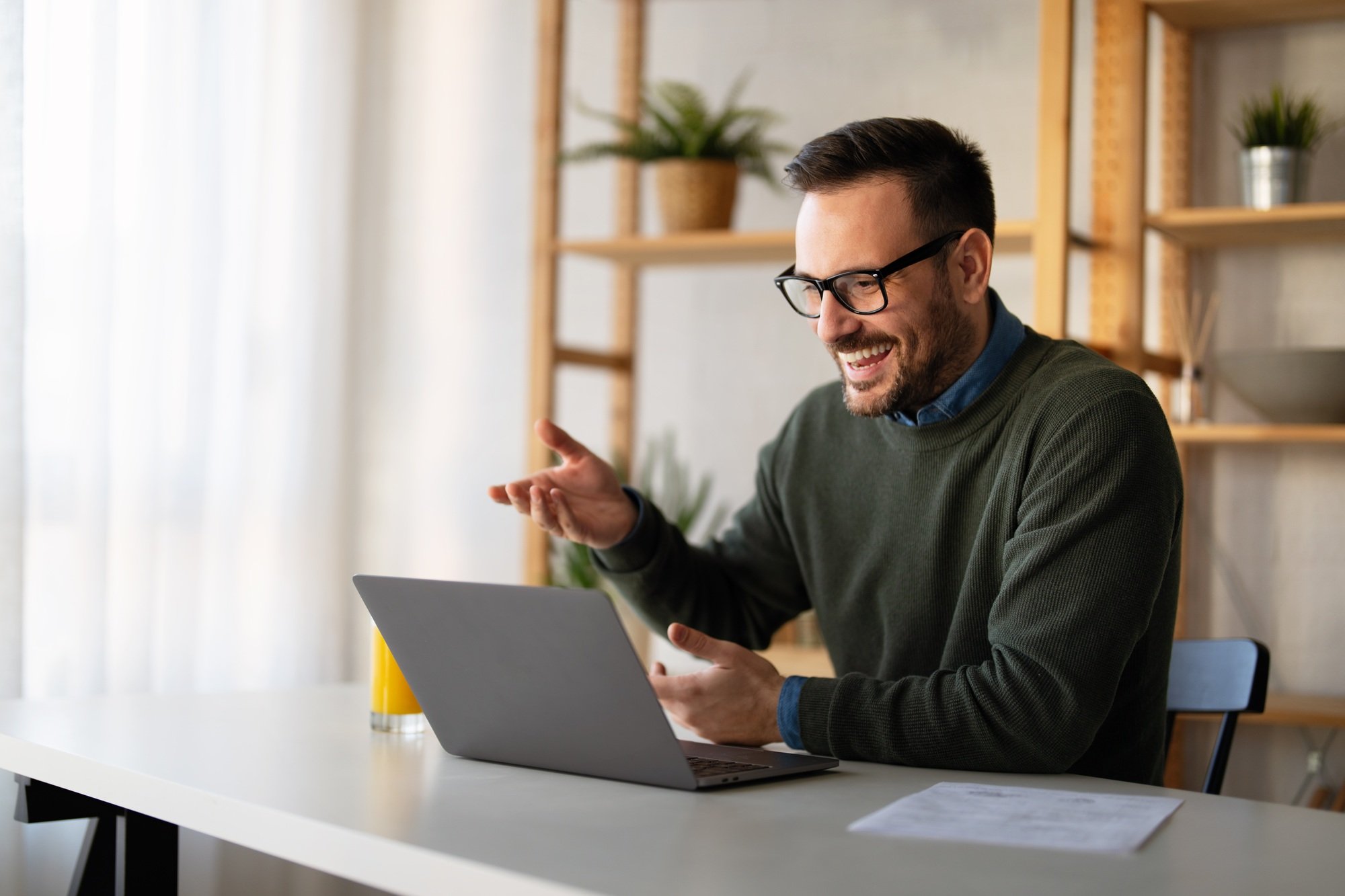 Businessman executive coach using laptop computer, having video conference call virtual meeting