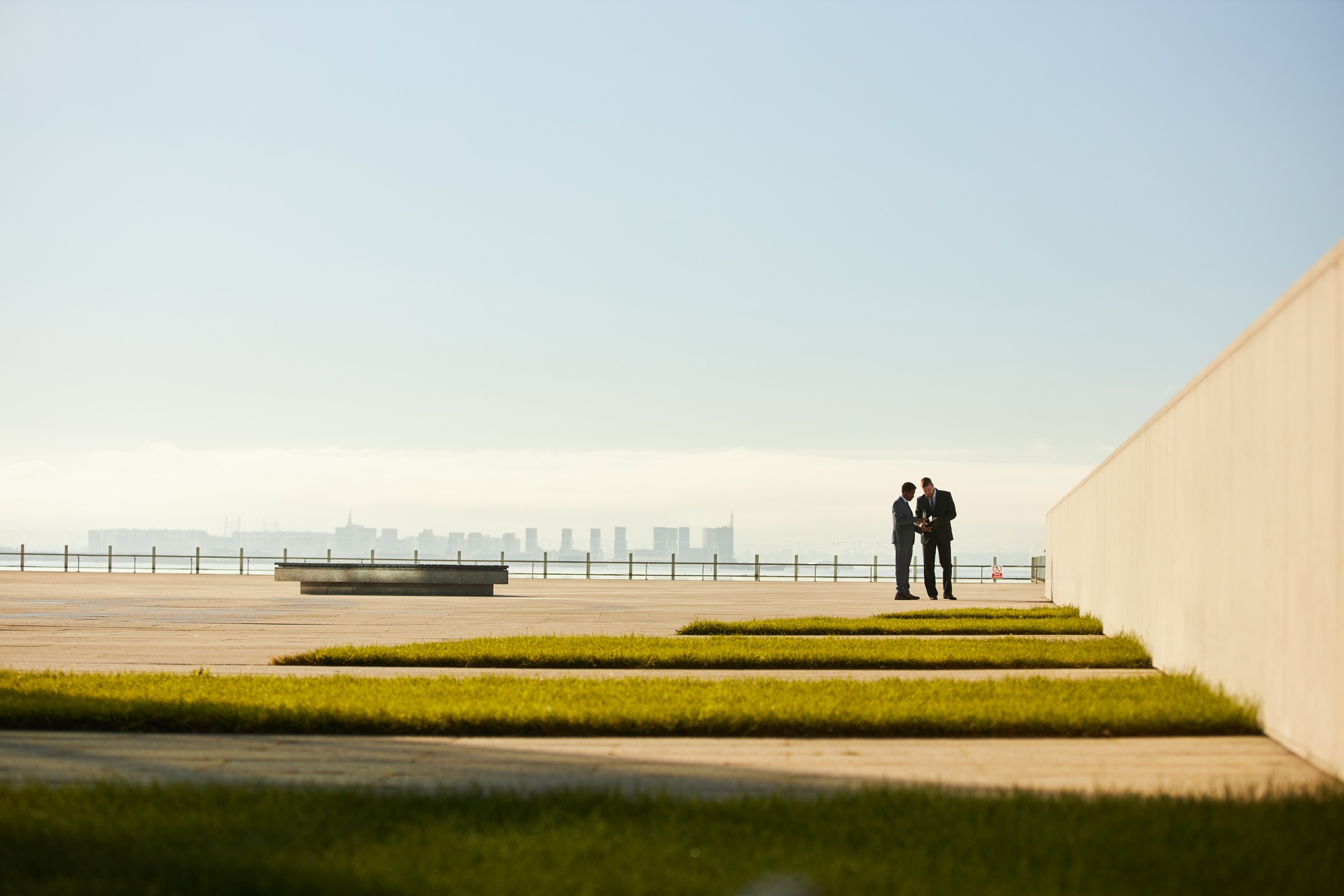 Discussing Business Plans on Modern Rooftop with Copy Space
