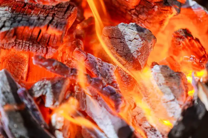 Glowing coals in a barbeque grill coal fire smoke