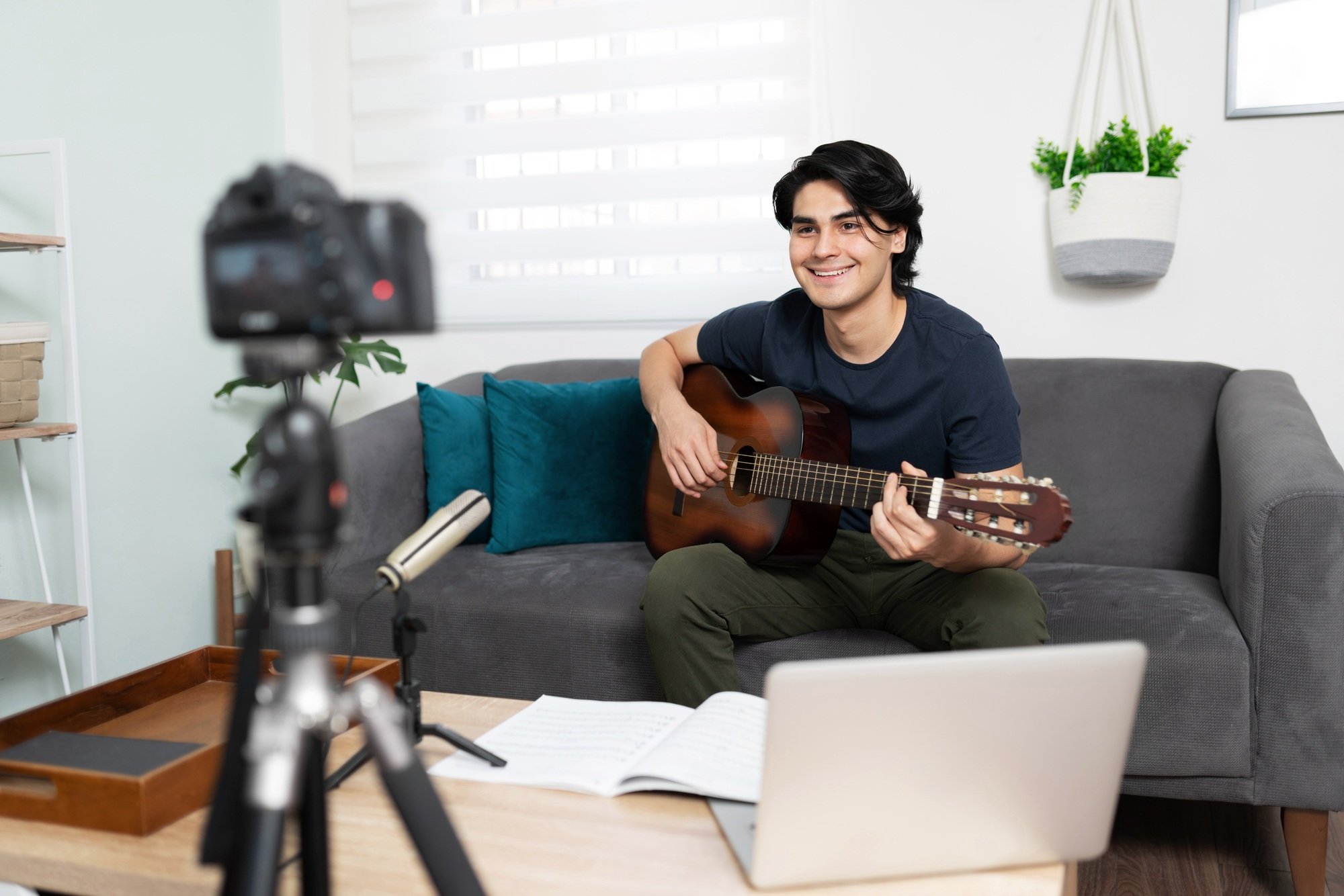 Musician and blogger recording a song online