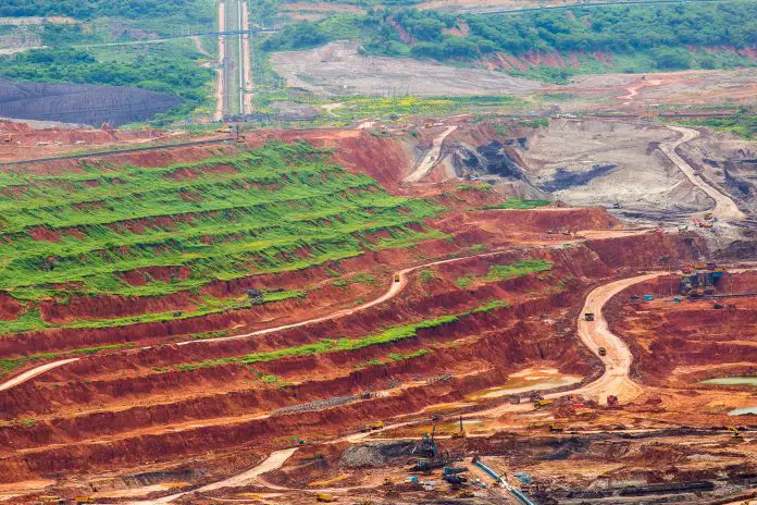 Part of a pit with big mining truck working