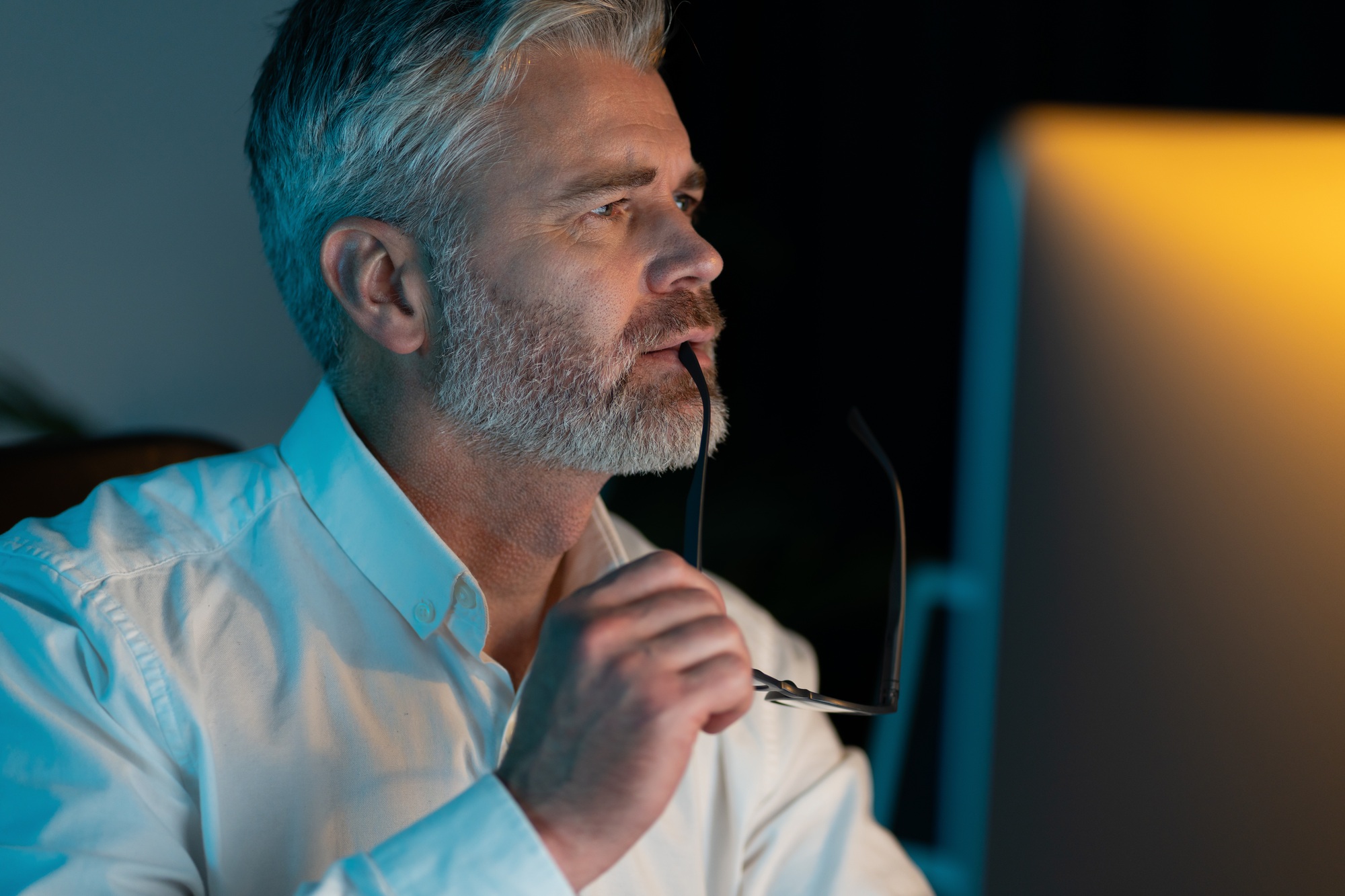 Pensive Mature Man in Office Contemplating Ideas and Solutions