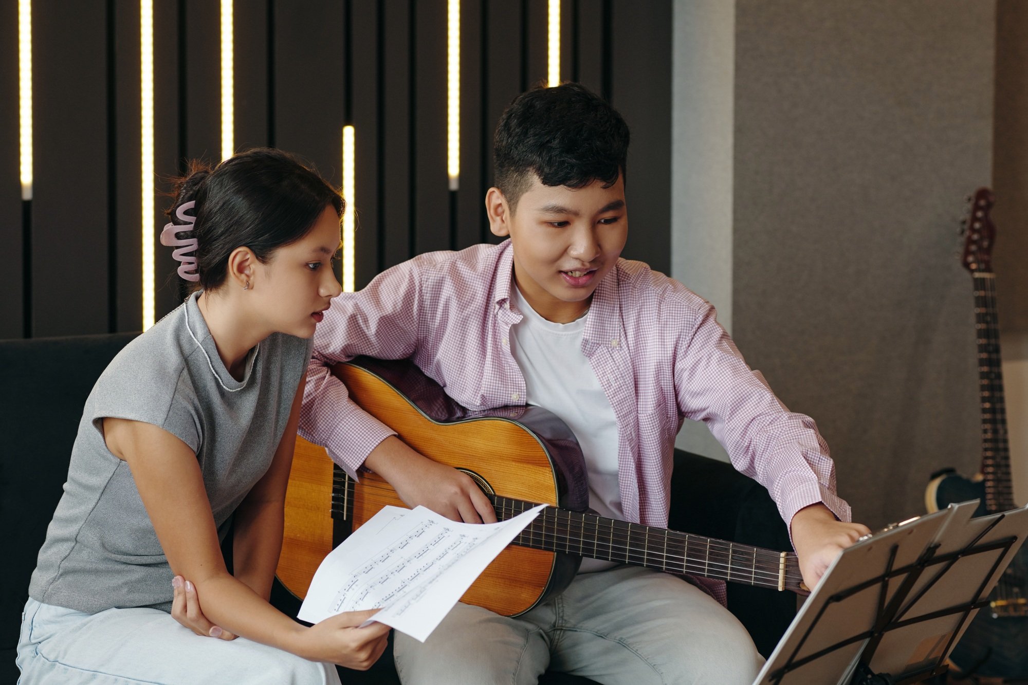Playing Acoustic Guitar in Modern Studio Setting