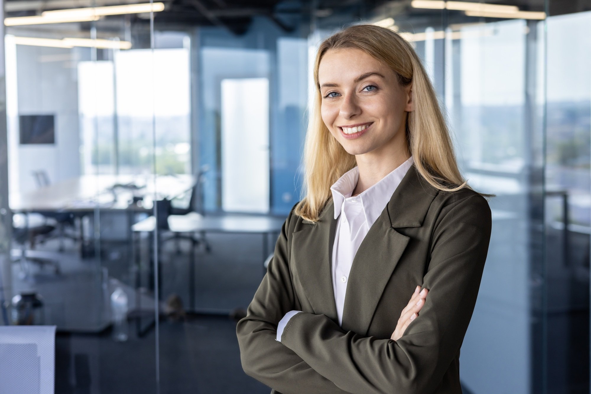 Portrait of a successful and smiling business woman, the founder of the company, the director in a