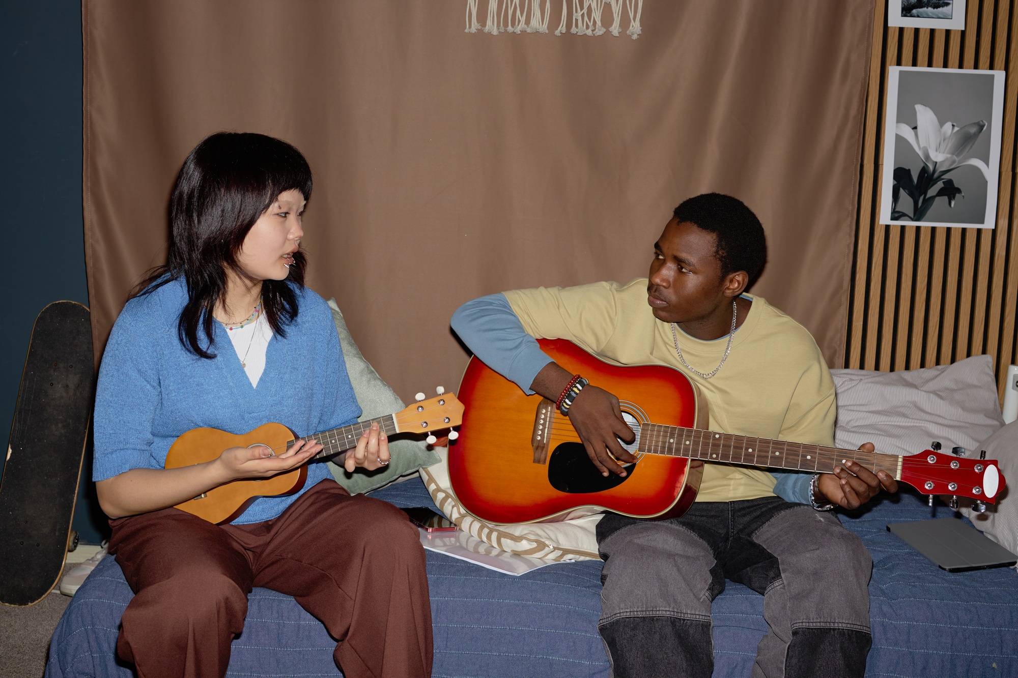Practicing Guitar and Ukulele on Living Room Sofa