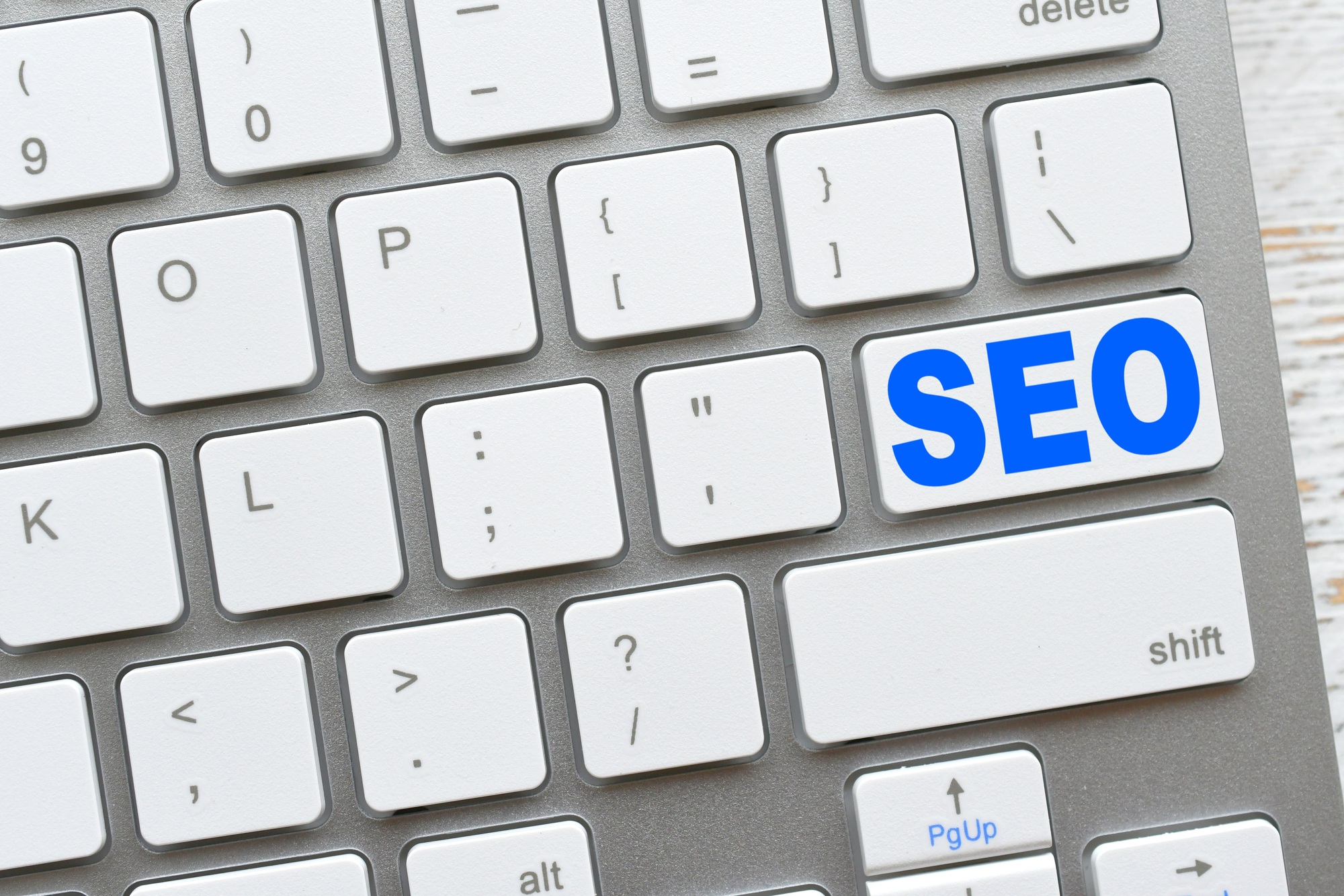 Search engine optimization concept -  SEO key on a white computer keyboard.