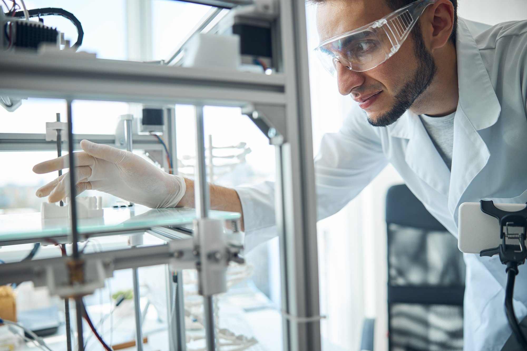 Serious man examining the 3D printed denture