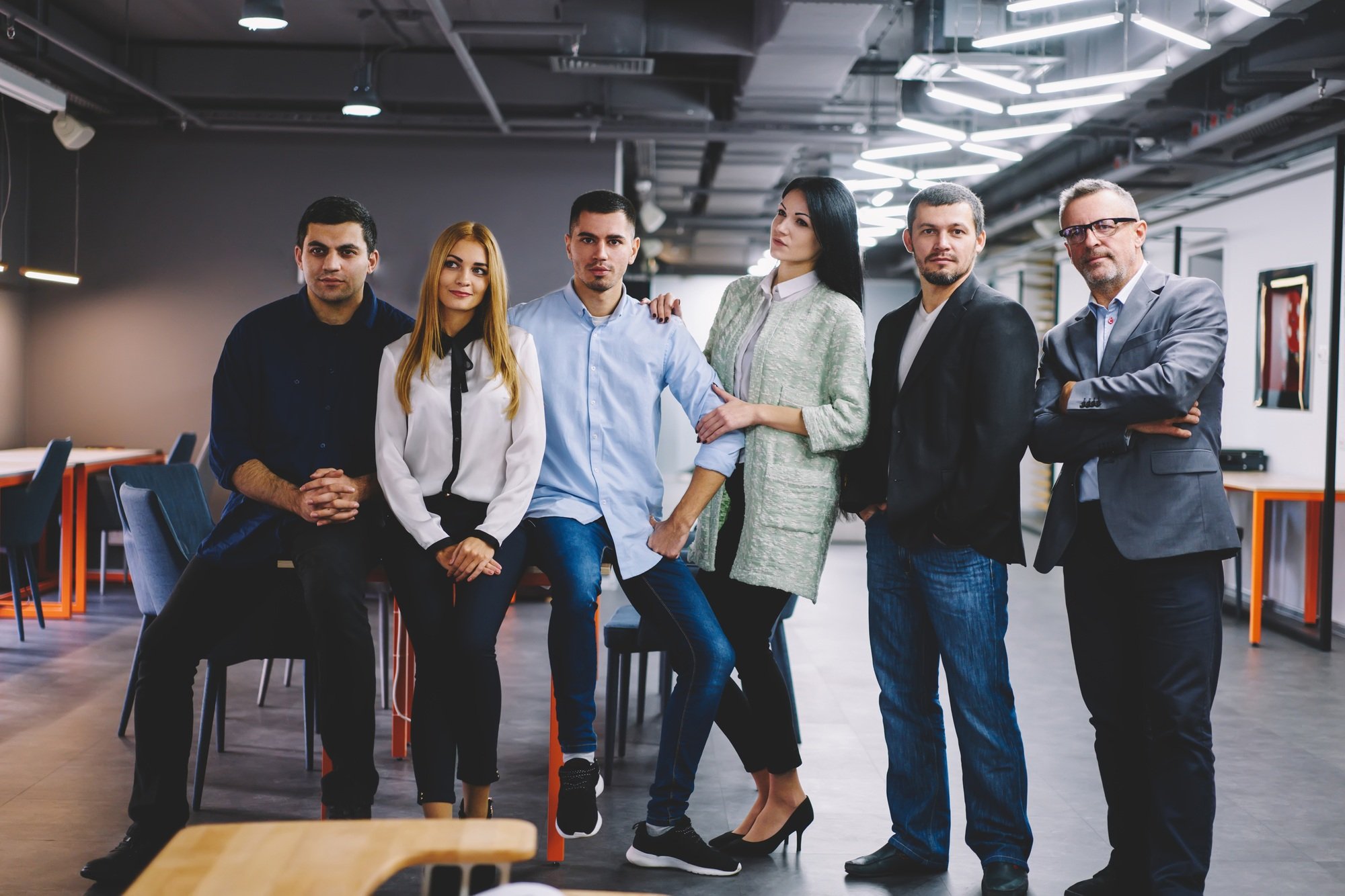 Smart casual corporate directors posing during time on job