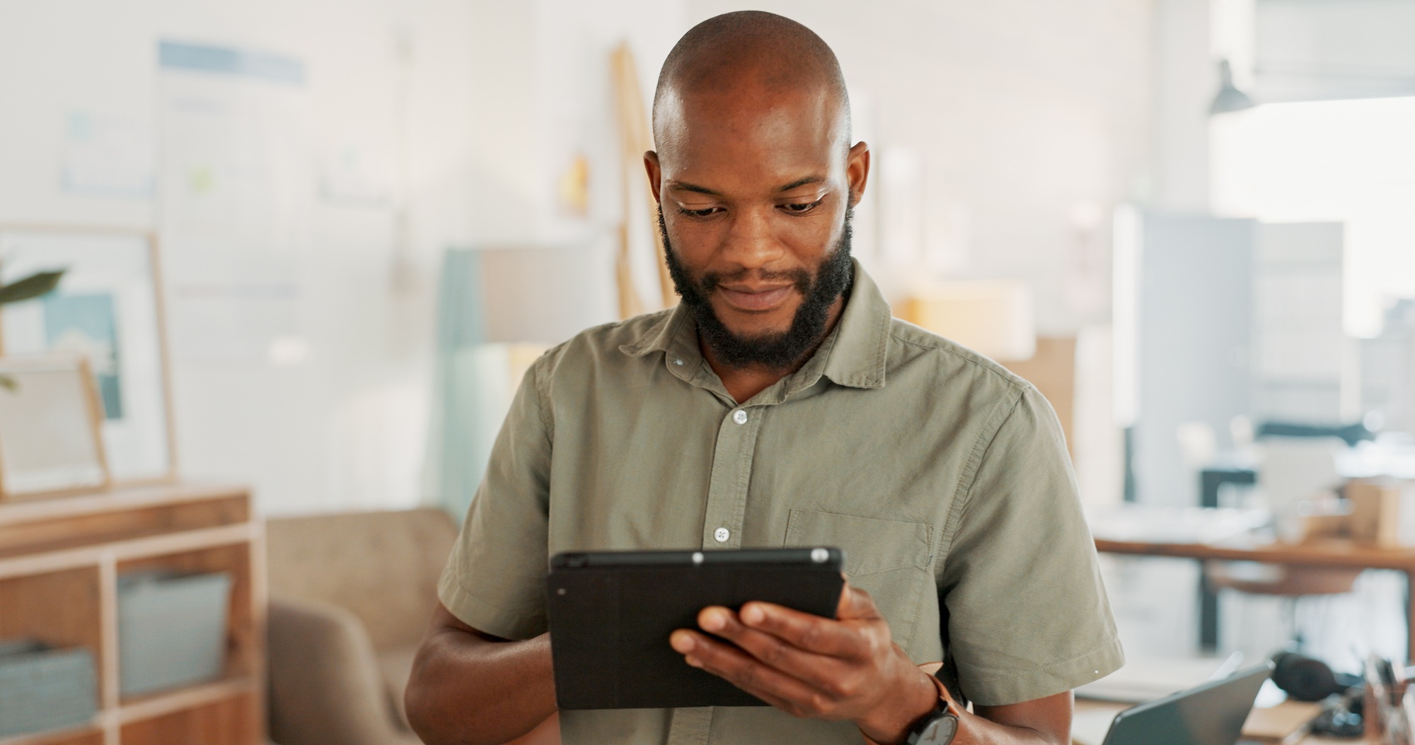 Tablet, office and business black man with digital marketing, company asset management and startup