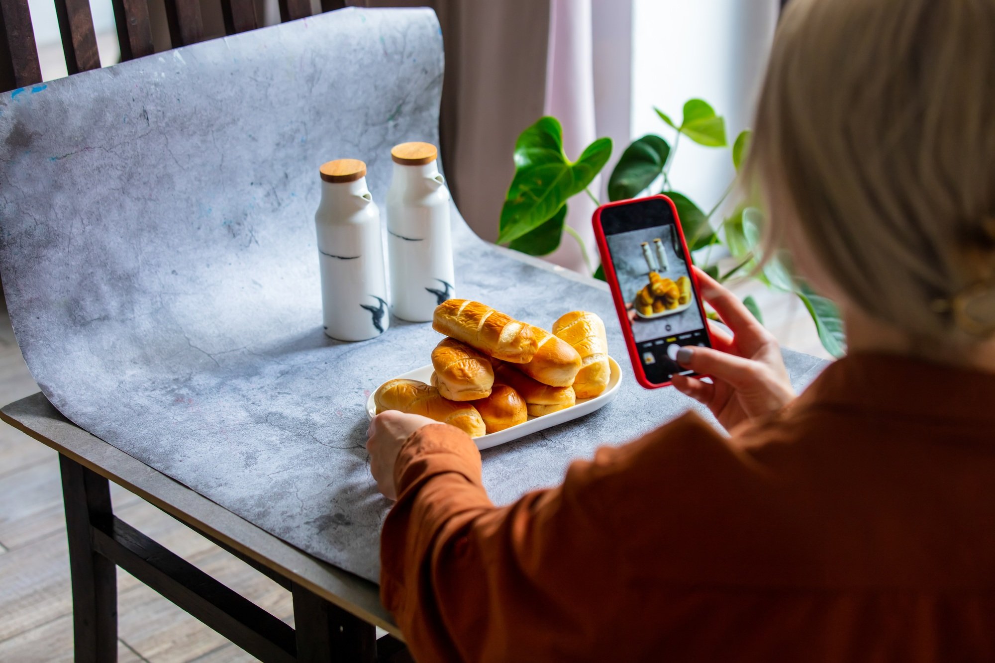 Woman make a photo of product for selling online in Internet from home