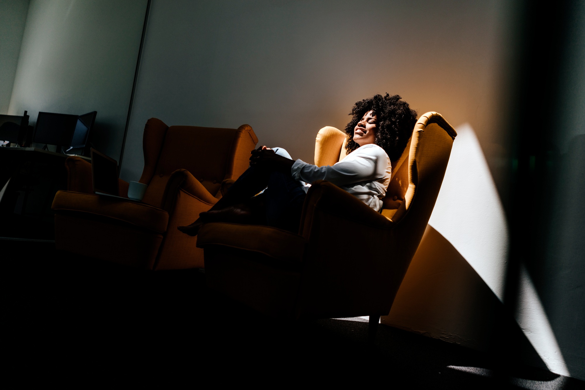 Young woman having a break in office