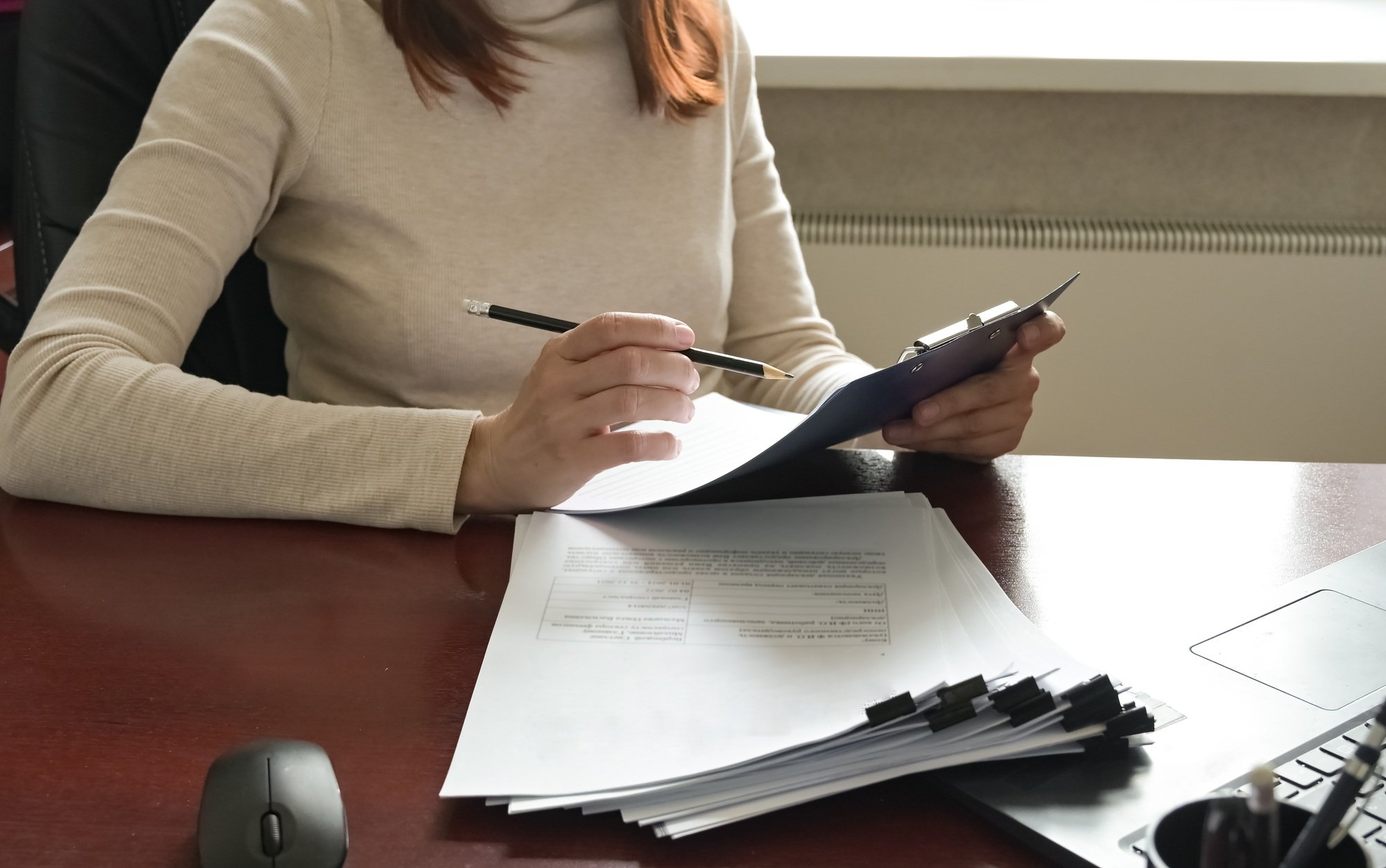 A close-up of employers or recruiters considering candidates' resumes, interviews, the concept