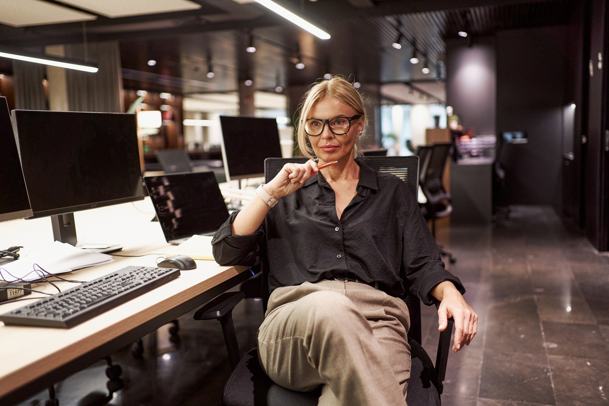 A Professional Woman in a Contemporary Modern Office Setting Engaging in Creative Activities