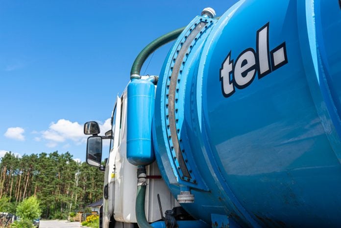 A truck with a large tank for pumping out a septic tank with a capacity of more than 20 cubic meters