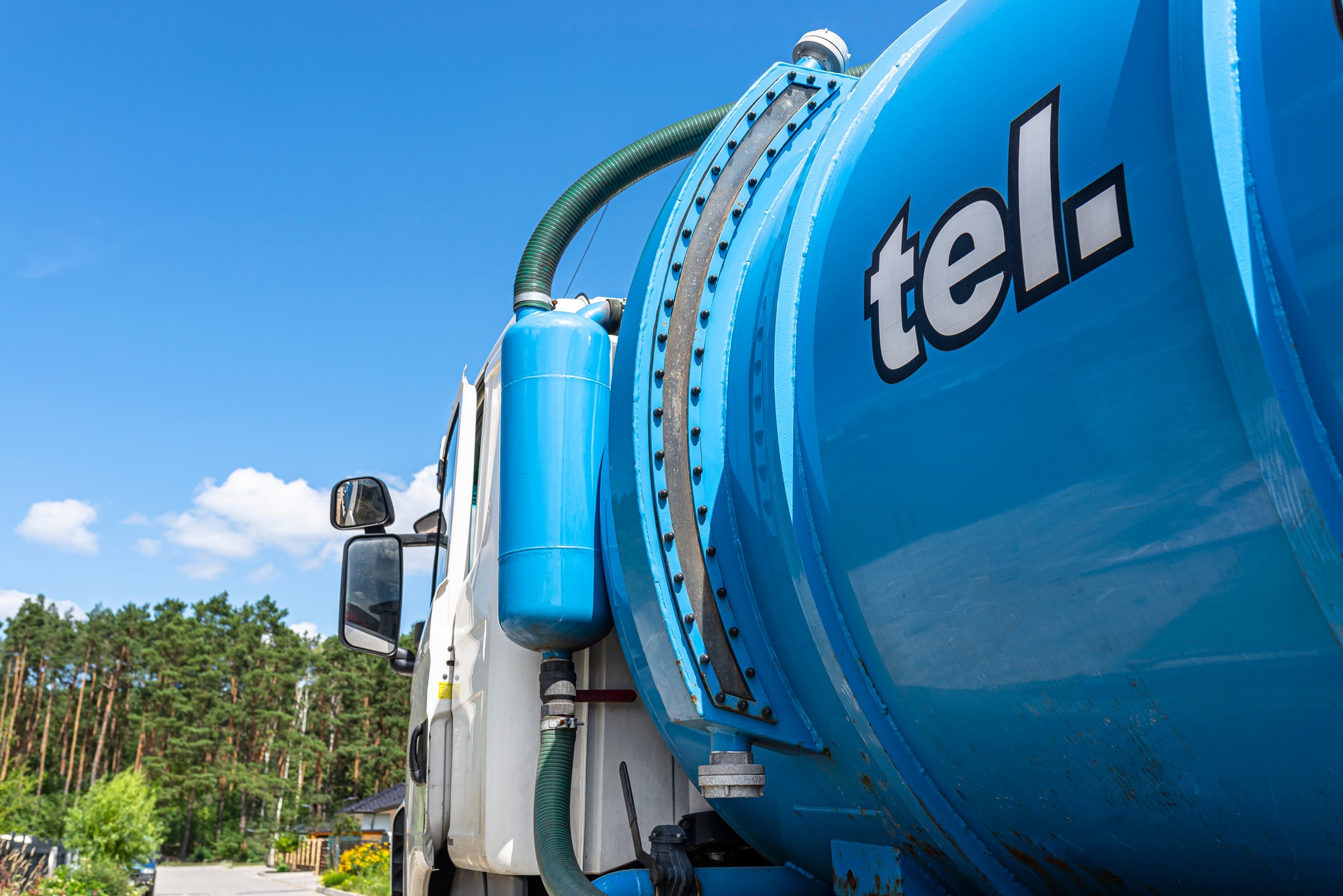 A truck with a large tank for pumping out a septic tank with a capacity of more than 20 cubic meters