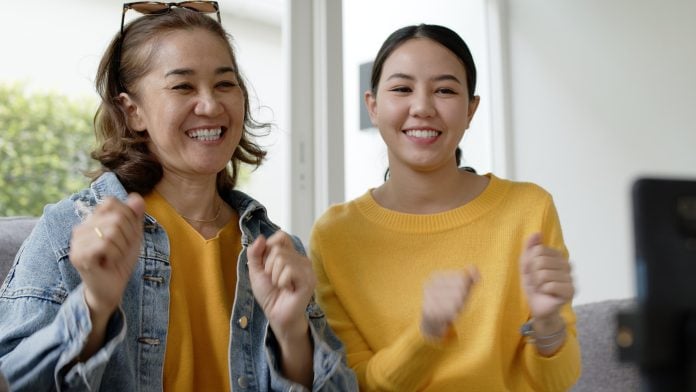 Asia senior parent and girl in Mom day joy play music recording vlog viral shooting on social media