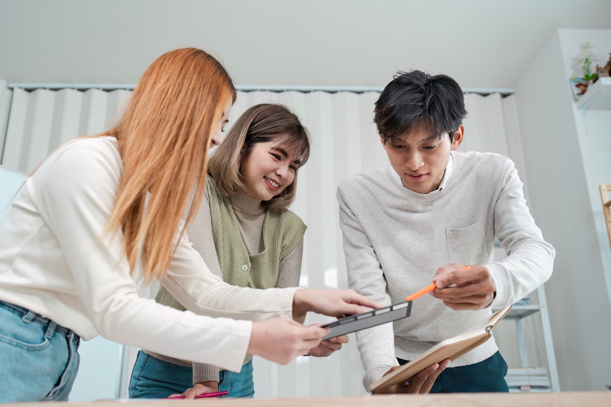 Asian business creative team work together, mobile application software design project. Brainstorm