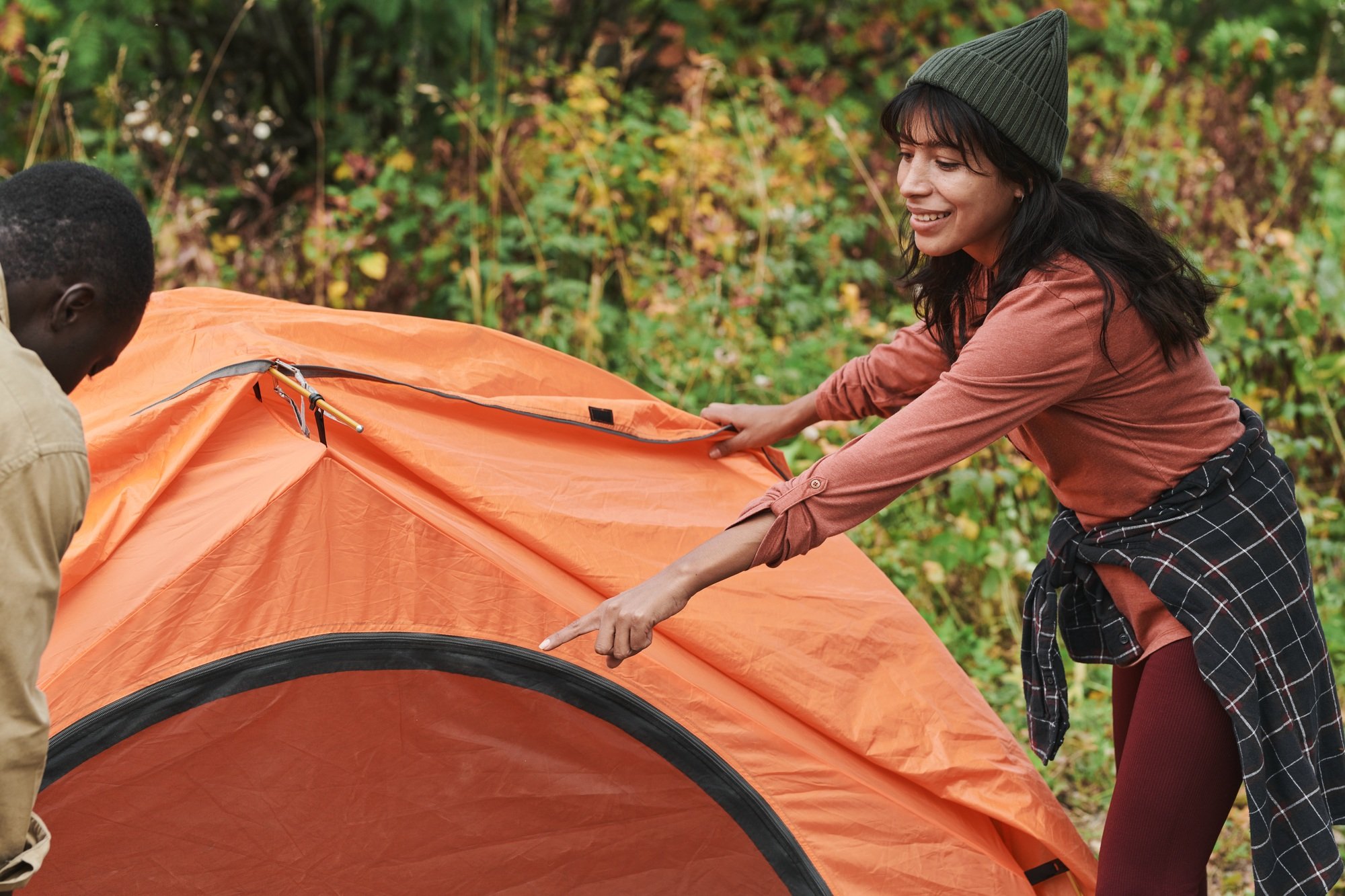Assisting boyfriend to set up tent