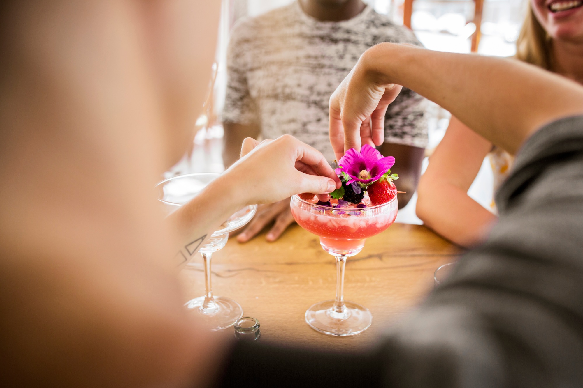 Bartender preparing colorful cocktail