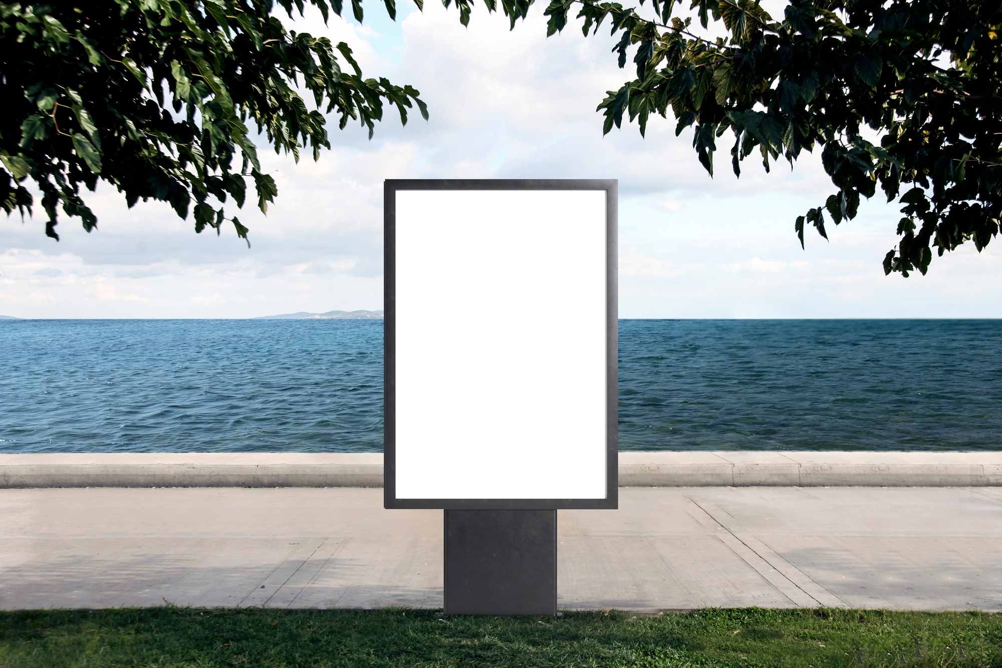 Billboard in front of the seashore on a sunny day