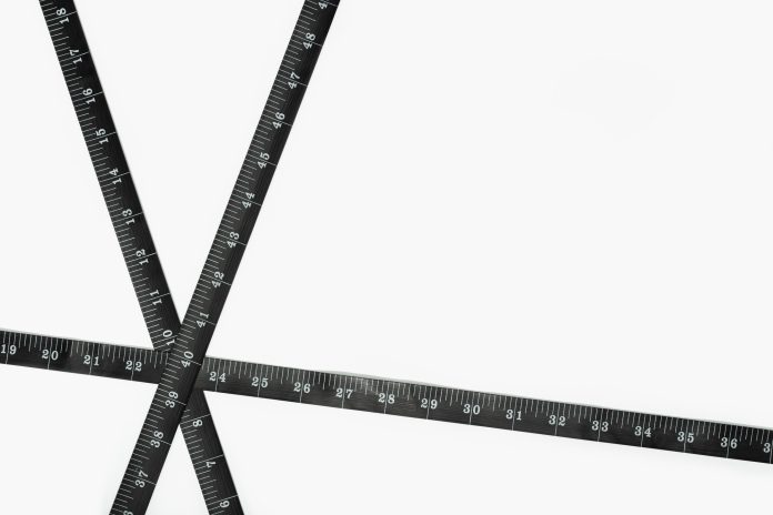 Black Measure tape on white background