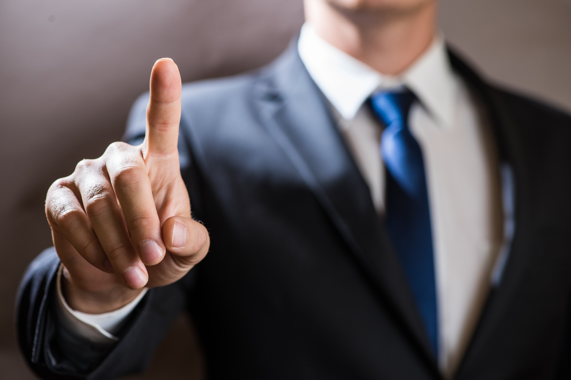Businessman click on virtual touchscreen. Futuristic IT presentation background