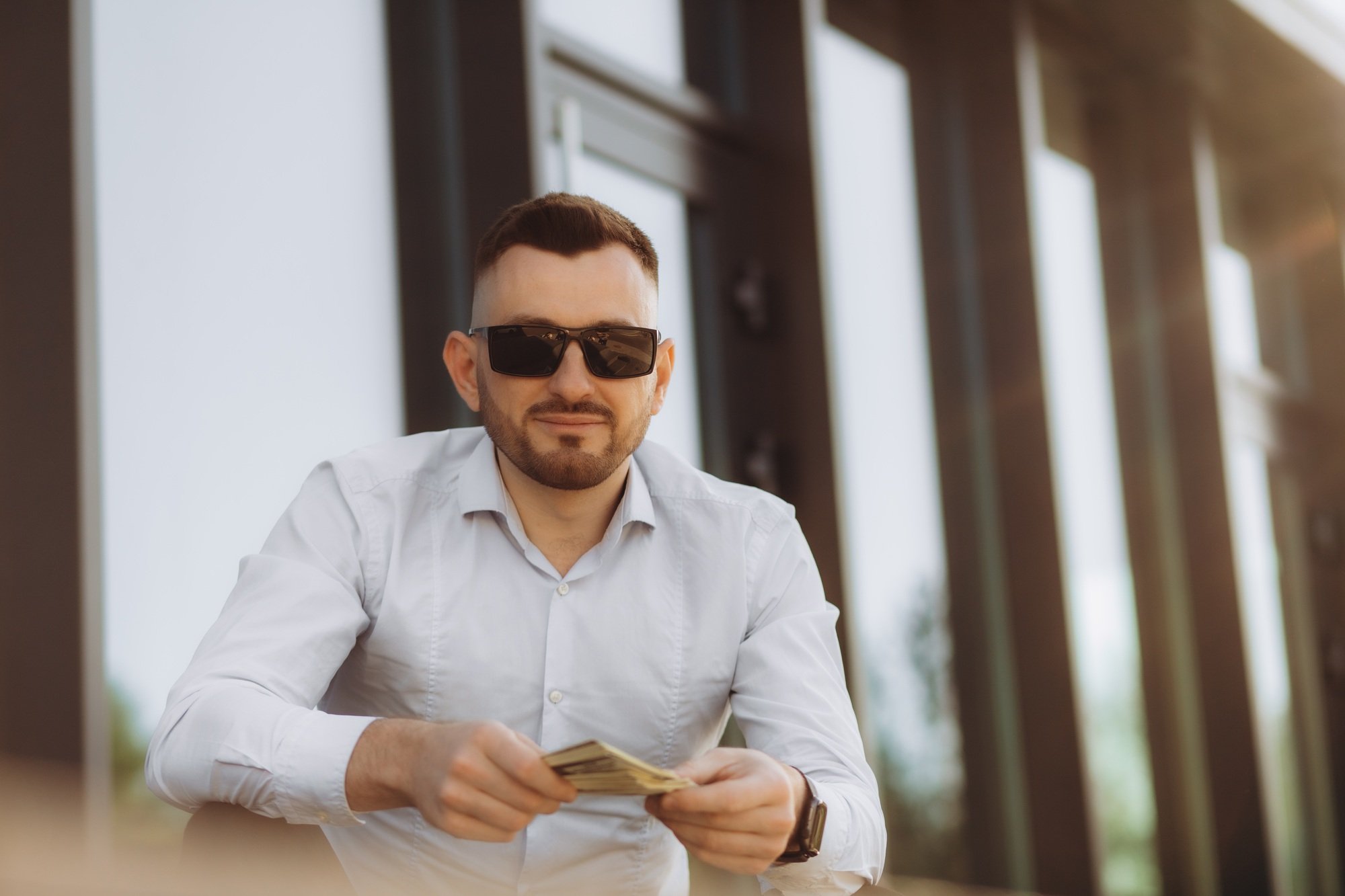 Businessman holding dollar bills