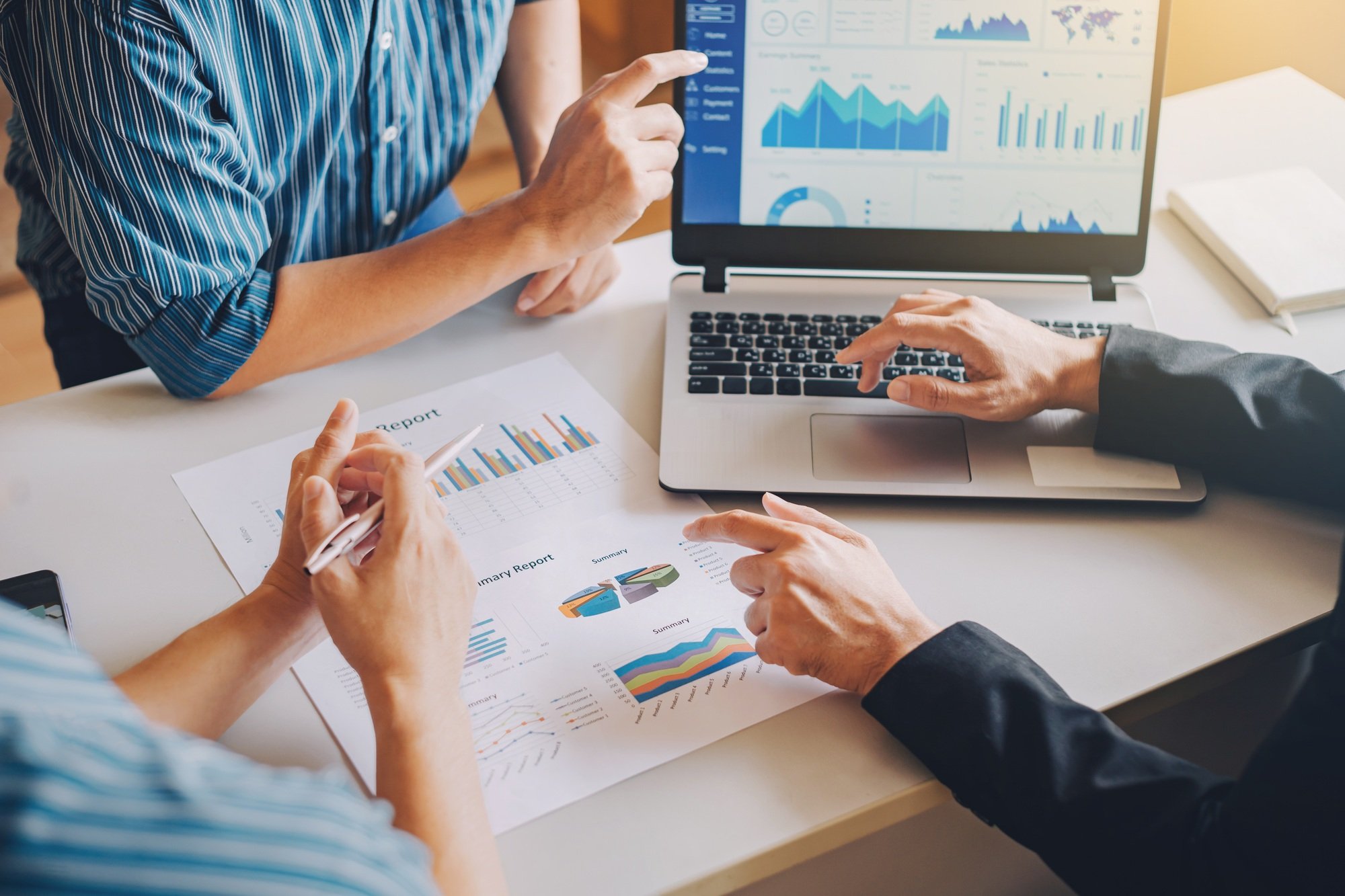 Businessman investment consultant analyzing company financial report balance sheet statement working