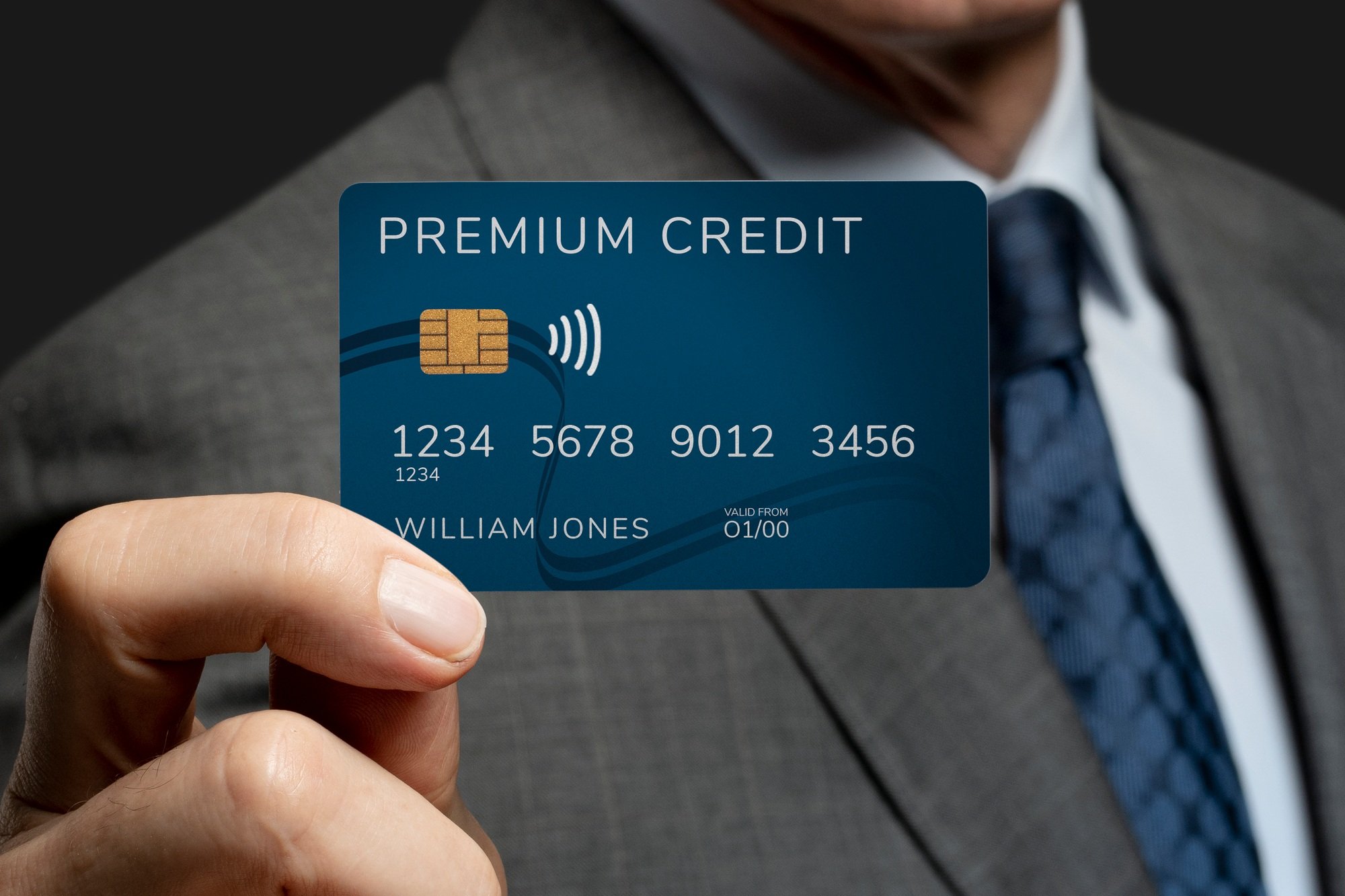 Businessman showing a credit card