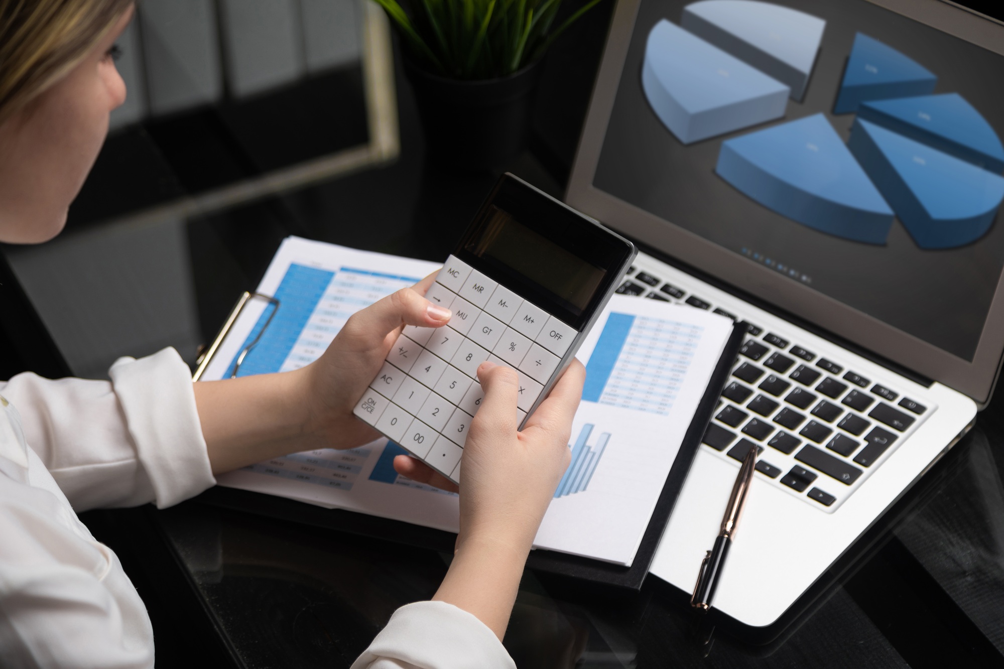 Businesswoman investment consultant analyzing company annual financial report balance sheet
