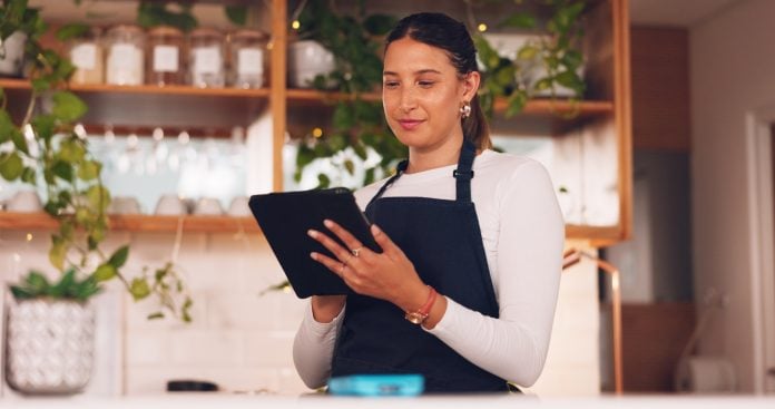 Cafe barista or happy woman on tablet for ecommerce, online services and restaurant sales promotion