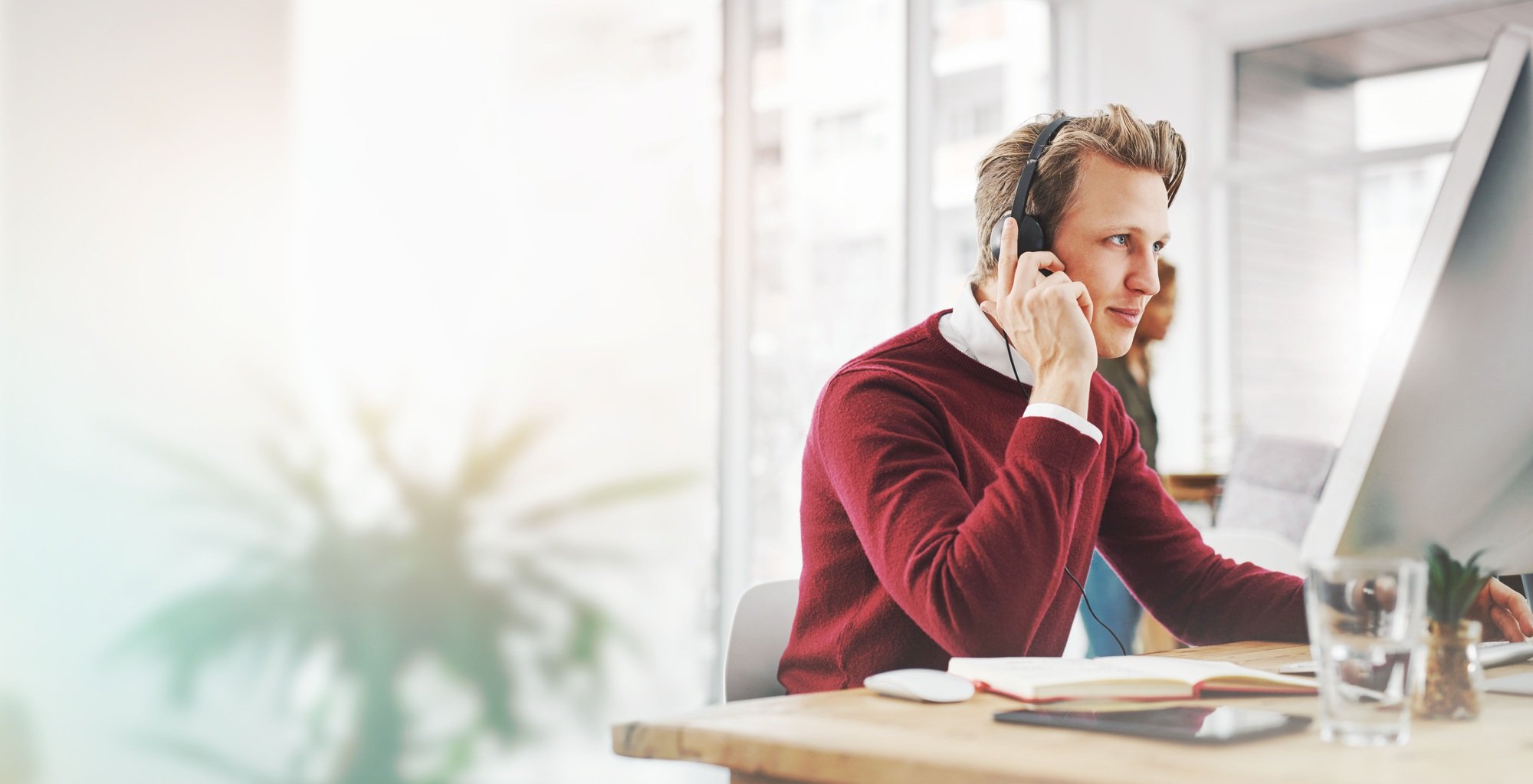 Call center, customer service and man in office consulting in telemarketing, crm or contact us. Onl