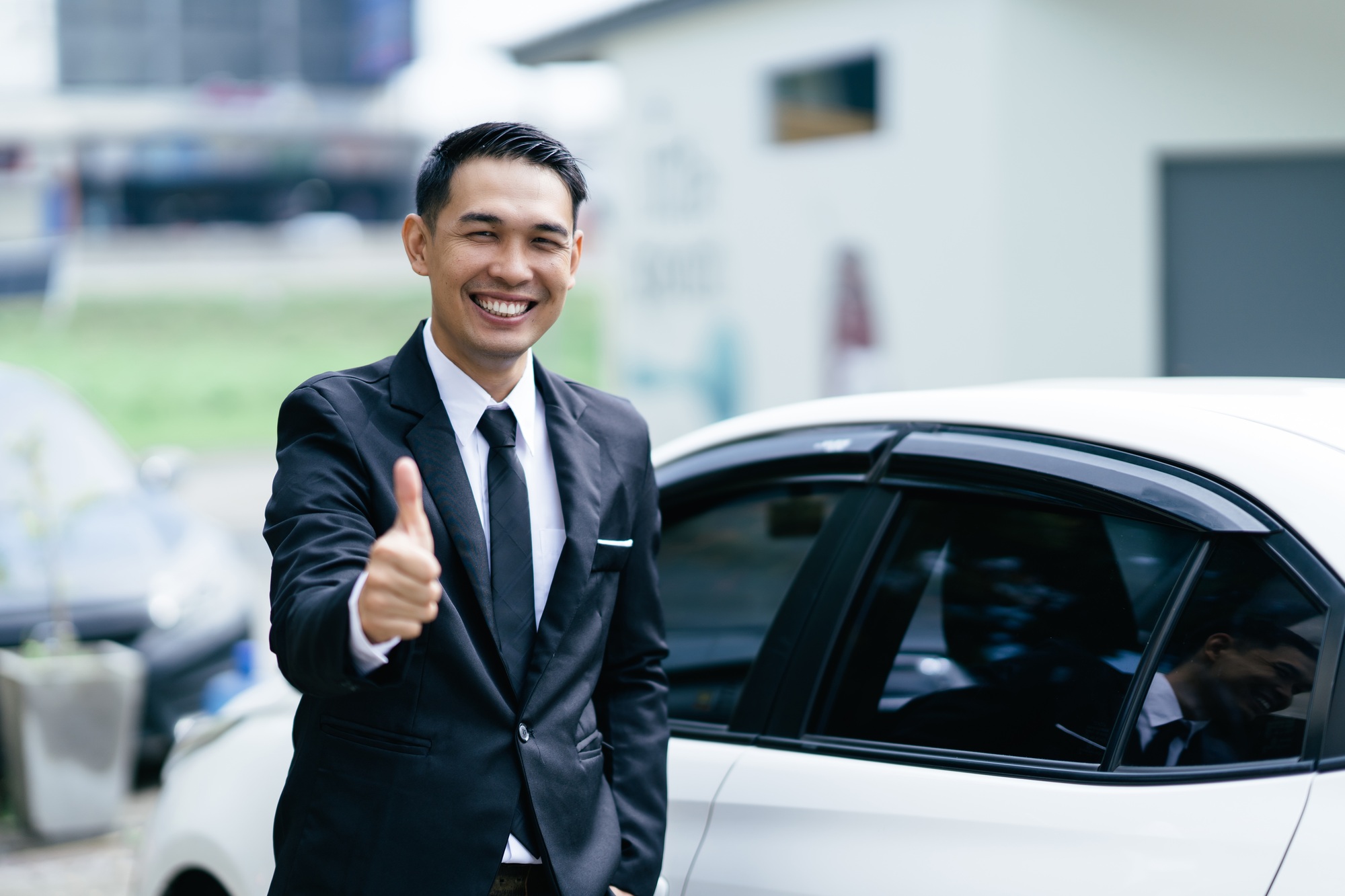 Car dealer man. Auto dealership and rental concept.