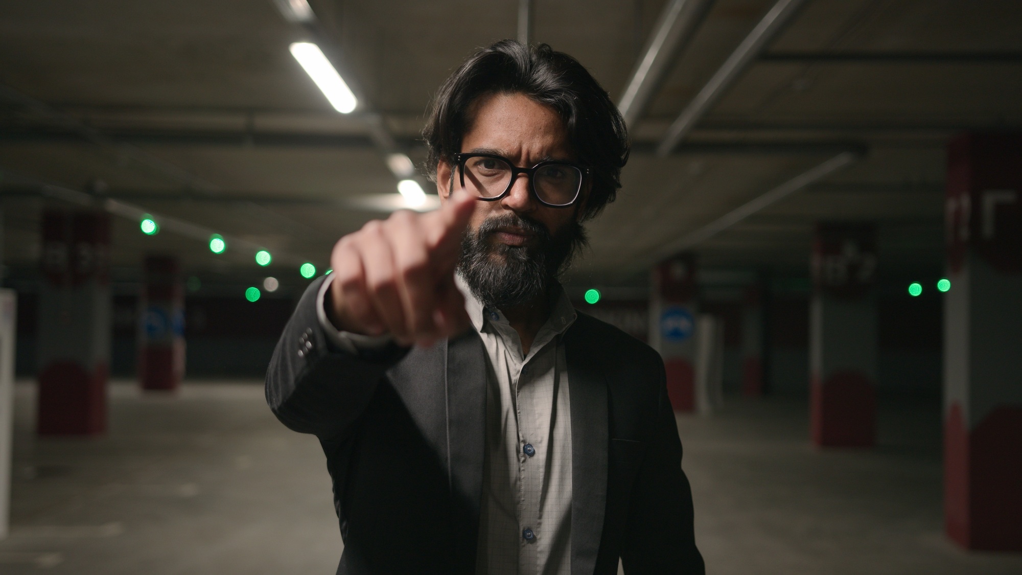 Close-up serious Indian man HR manager choosing candidate for job point finger at camera making