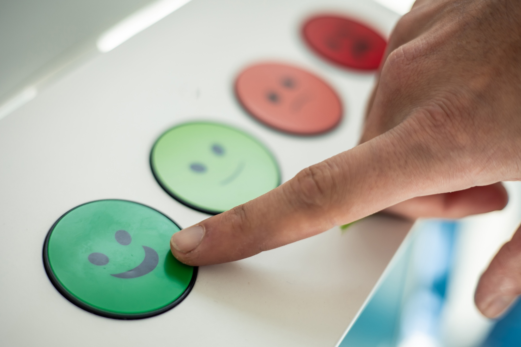 closeup finger pressing green face good rating