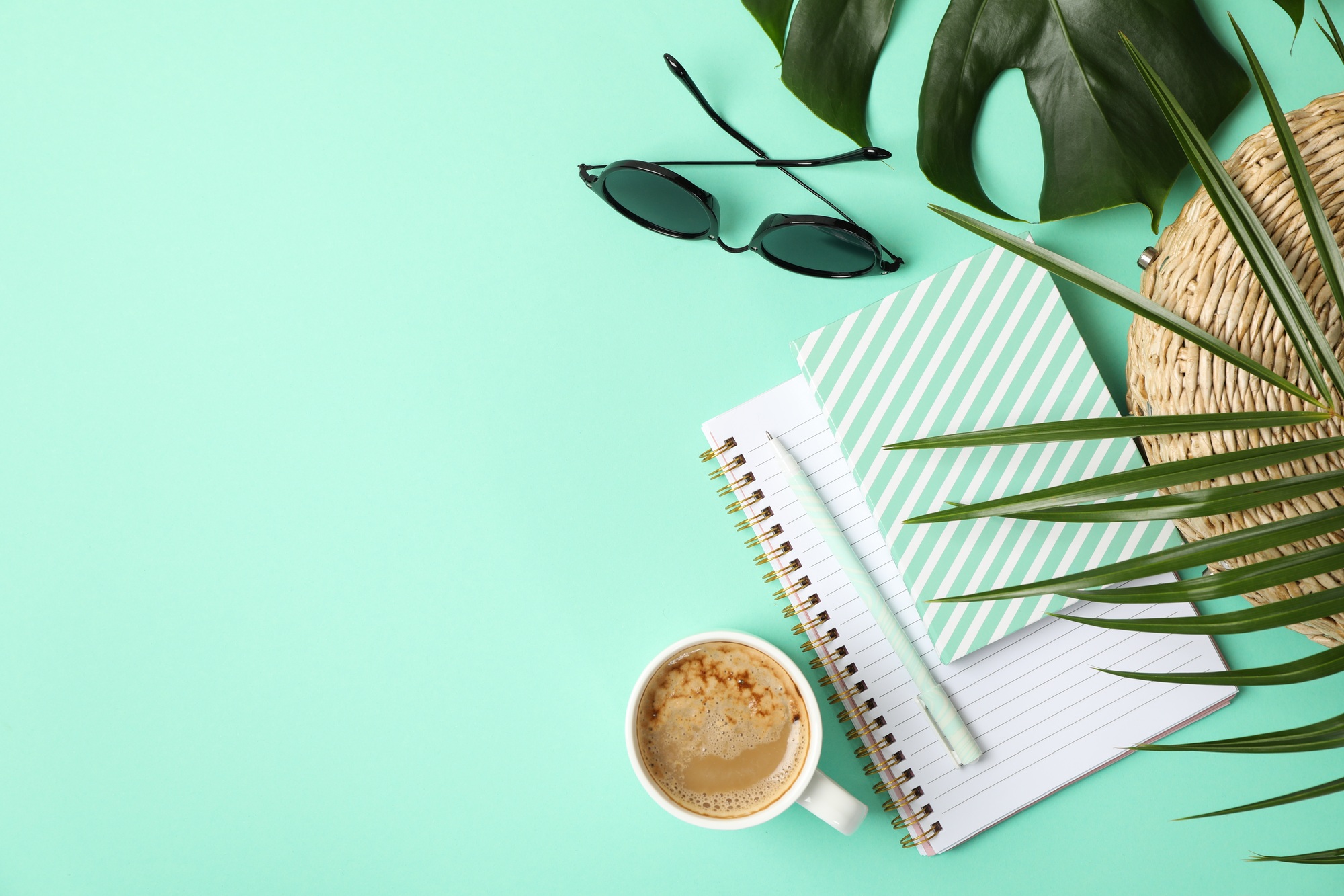 Composition with blogger accessories on mint background. Travel blog