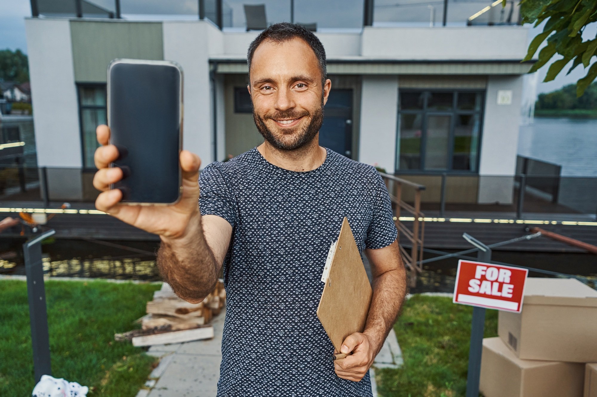 Confident real estate agent advertising his company