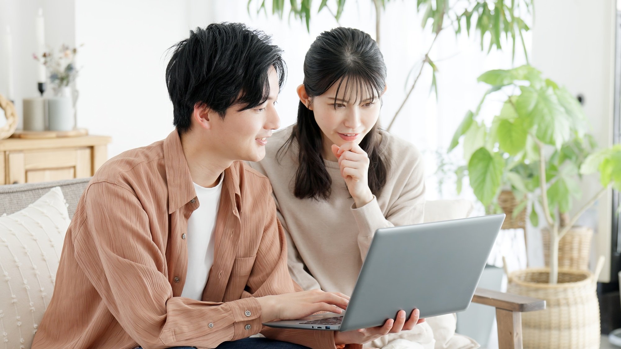 Couples browsing real estate and travel sites